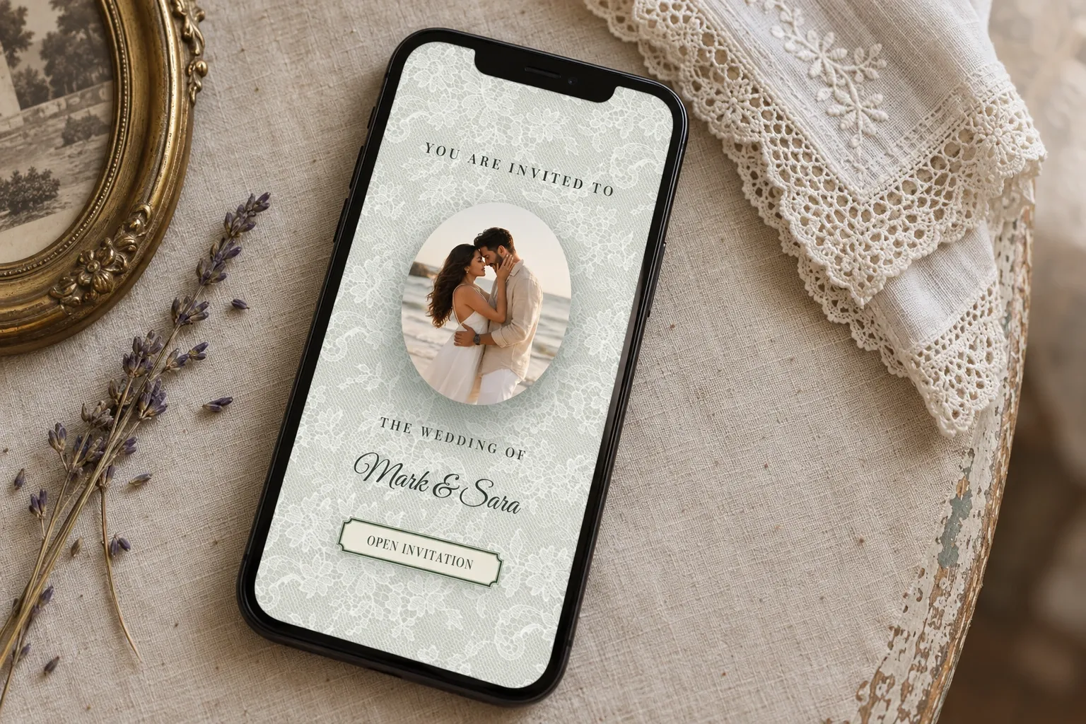 Olive and Ivory lace opening screen on a diagonal phone beside ivory linen, pressed lavender and an antique gold frame